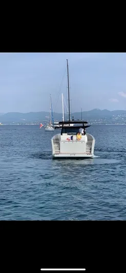  Yacht Photos Pics 2023 MedYacht 42 cruising on calm sea with distant sailboats.