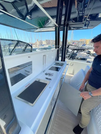  Yacht Photos Pics 2023 MedYacht 42 with outdoor kitchen, docked at marina, featuring sleek design and modern amenities.