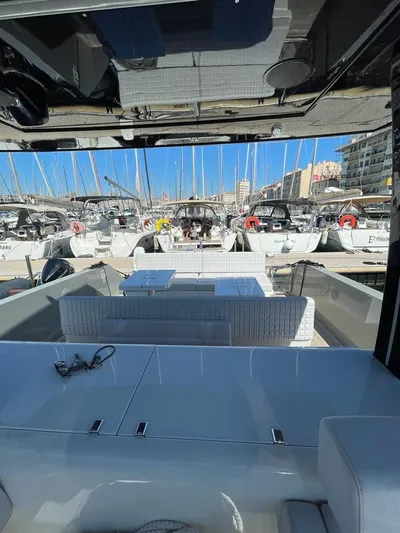  Yacht Photos Pics Luxury MedYacht 42, 2023 model, docked in marina with elegant seating and clear blue sky.