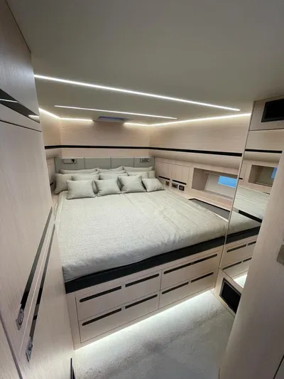  Yacht Photos Pics Luxurious bedroom interior of 2023 MedYacht 42 with modern lighting and elegant design.
