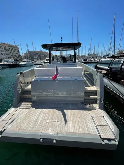  Yacht Photos Pics 2023 MedYacht 42 docked in marina, showcasing sleek design and spacious deck.