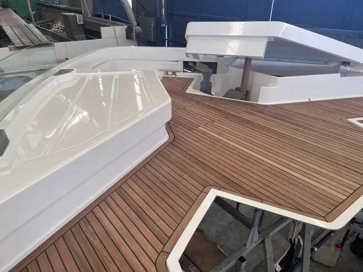 L88 Yacht Photos Pics Luxury yacht deck with sleek design, featuring wood finish. Ladenstein 88, 2025 model.