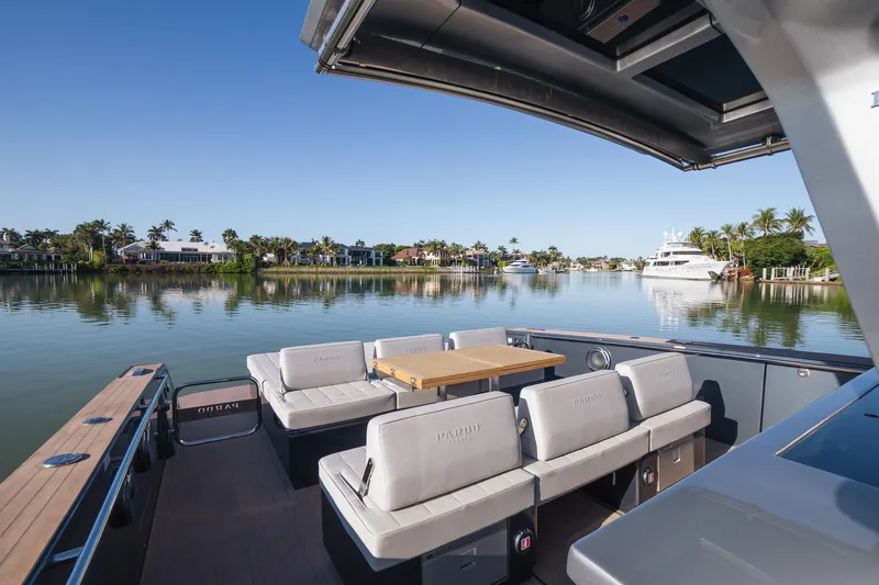  Yacht Photos Pics 2025 Pardo Yachts 43 interior with seating, table, and scenic waterfront view.