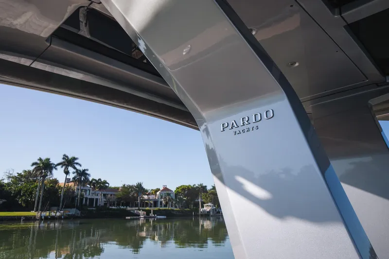  Yacht Photos Pics 2025 Pardo Yachts 43, sleek design, docked near waterfront homes and palm trees.