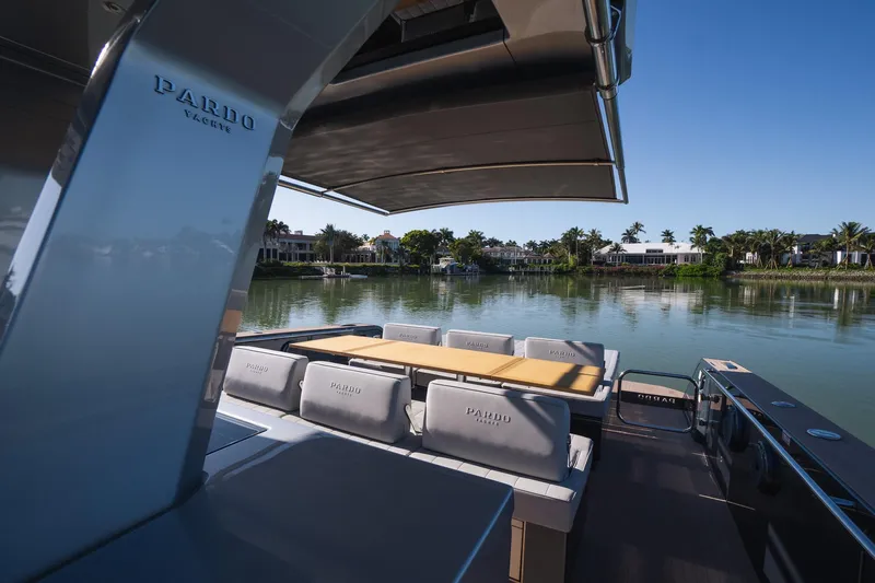  Yacht Photos Pics 2025 Pardo Yachts 43 on serene water, showcasing luxury seating and sleek design.