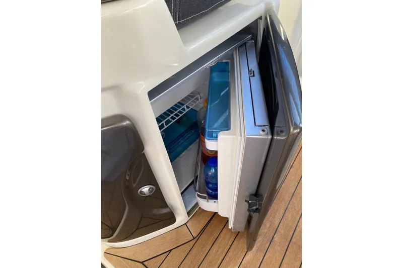  Yacht Photos Pics Open mini fridge on 2009 Cranchi Endurance 33 yacht, showing beverages inside.