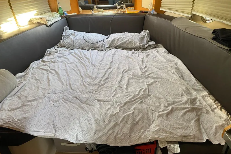  Yacht Photos Pics Interior of 2009 Cranchi Endurance 33 with a cozy bed setup and soft lighting.