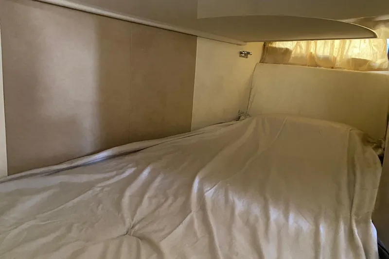  Yacht Photos Pics Interior cabin of 2009 Cranchi Endurance 33 with bed and curtains.