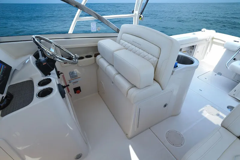 Plan B Yacht Photos Pics Manufacturer Provided Image: 2019 Grady-White Freedom 307 boat interior with helm and seating, ocean view.