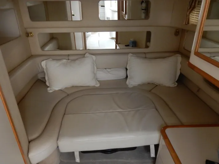 Sandi Yacht Photos Pics Interior of 1997 Sea Ray 450 yacht with beige seating and cushions.