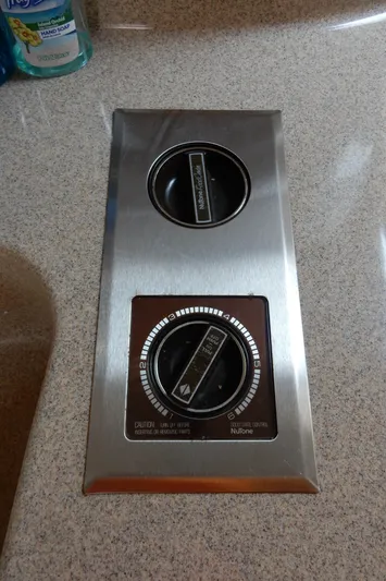 Sandi Yacht Photos Pics Control panel on 1997 Sea Ray 450 boat, featuring two dials on a countertop.