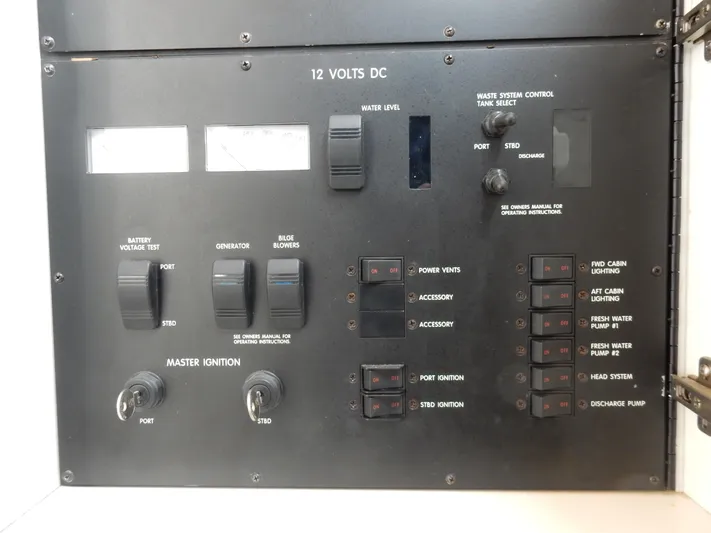 Sandi Yacht Photos Pics Control panel of a 1997 Sea Ray 450 boat, featuring switches and gauges for various functions.