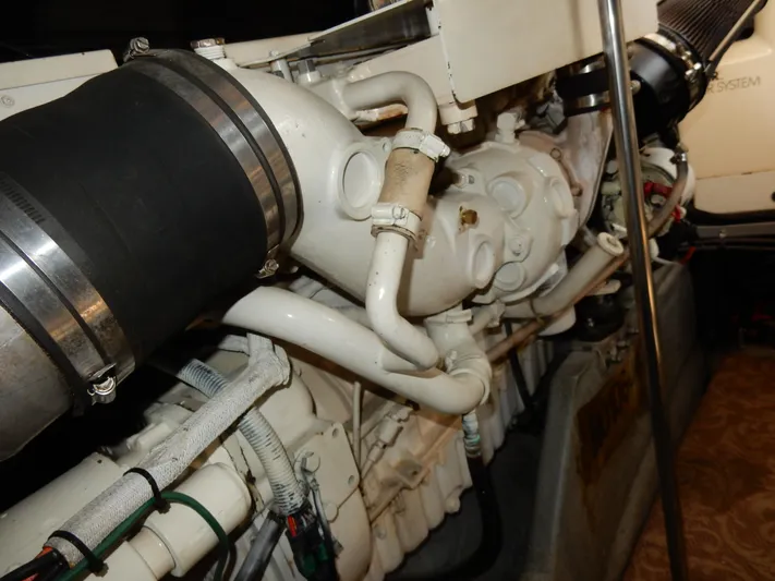 Sandi Yacht Photos Pics Engine components of a 1997 Sea Ray 450 boat, showcasing intricate piping and mechanical details.