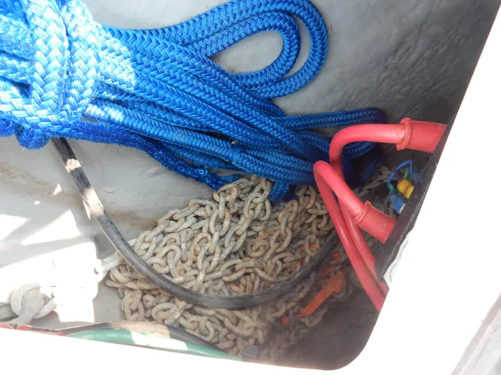 Sandi Yacht Photos Pics Blue ropes and chains in a 1997 Sea Ray 450 storage compartment.