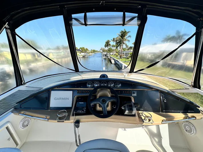 Live Big Yacht Photos Pics Interior view of 2004 Carver 360 Sport Sedan yacht cockpit with Garmin navigation.
