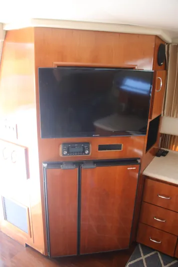 Live Big Yacht Photos Pics 2004 Carver 360 Sport Sedan interior with TV, stereo, and mini fridge.
