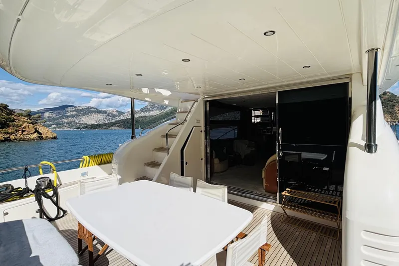  Yacht Photos Pics Luxurious 2007 Princess 21M yacht deck with scenic ocean view and elegant seating area.