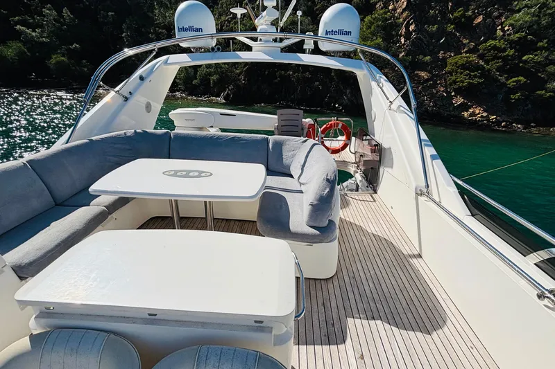  Yacht Photos Pics Luxurious 2007 Princess 21M yacht deck with seating and scenic water view.