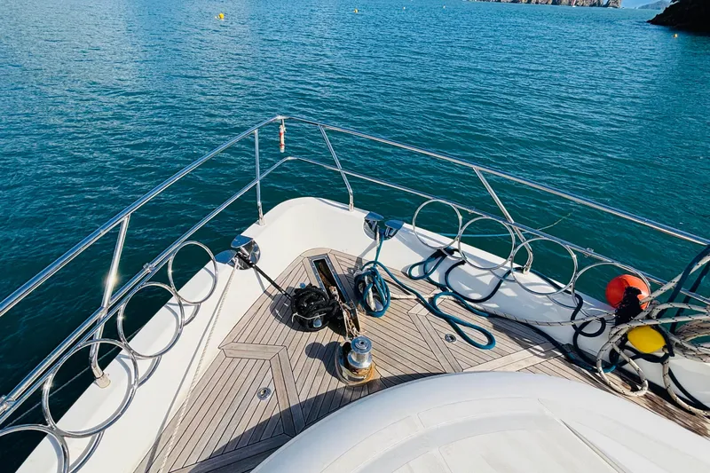  Yacht Photos Pics Bow of 2007 Princess 21M yacht with ropes and clear ocean view.