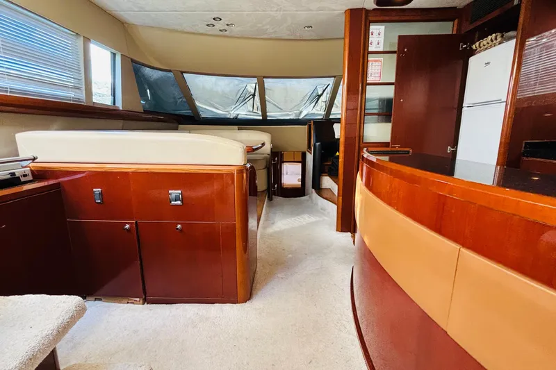  Yacht Photos Pics Luxurious interior of a 2007 Princess 21M yacht with elegant wood finishes.