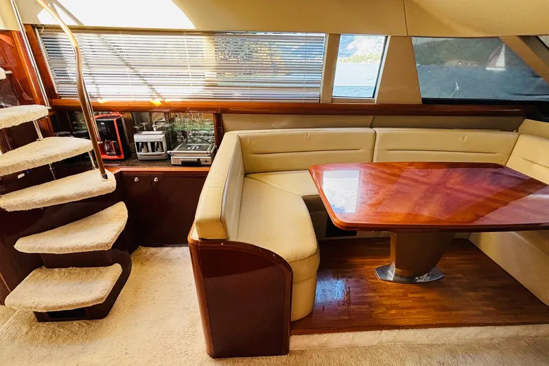  Yacht Photos Pics Luxurious interior of a 2007 Princess 21M yacht with plush seating and elegant wooden table.