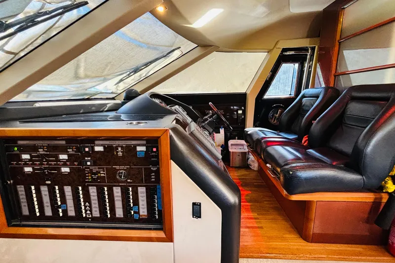  Yacht Photos Pics Interior of a 2007 Princess 21M yacht cockpit with leather seating and control panel.