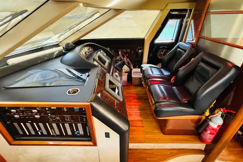  Yacht Photos Pics Interior cockpit of 2007 Princess 21M yacht with leather seats and control panel.