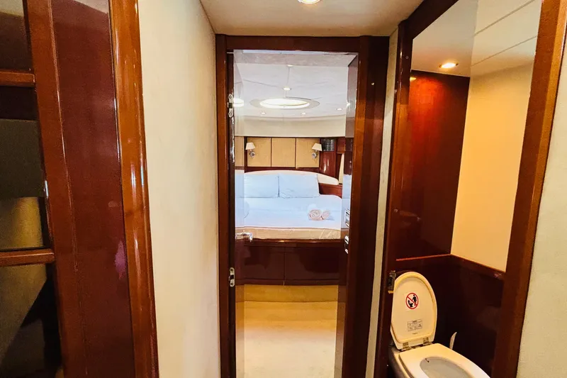  Yacht Photos Pics Luxurious interior of 2007 Princess 21M yacht featuring bedroom and bathroom.