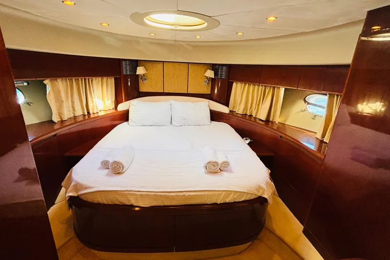  Yacht Photos Pics Luxurious cabin interior of 2007 Princess 21M yacht with elegant wood finish.