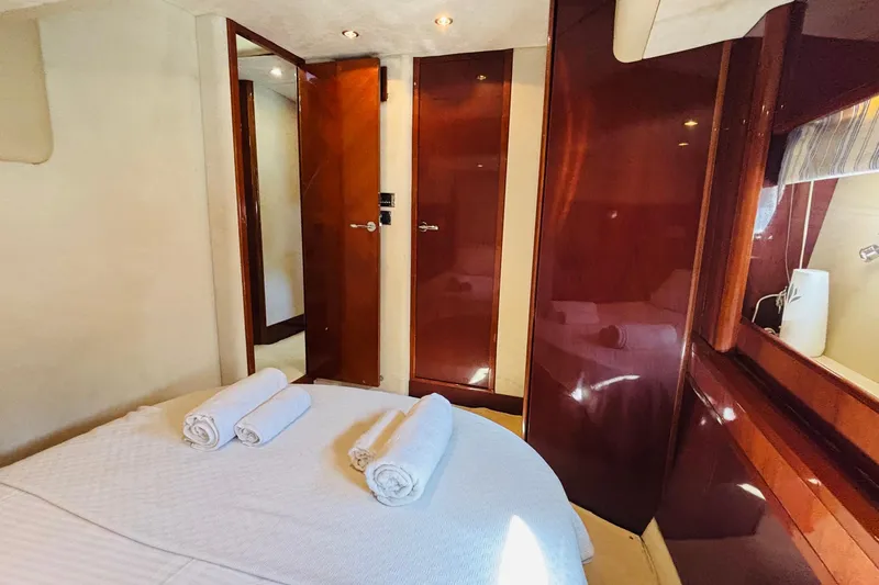  Yacht Photos Pics Luxurious cabin interior of 2007 Princess 21M yacht with elegant wood finishes.