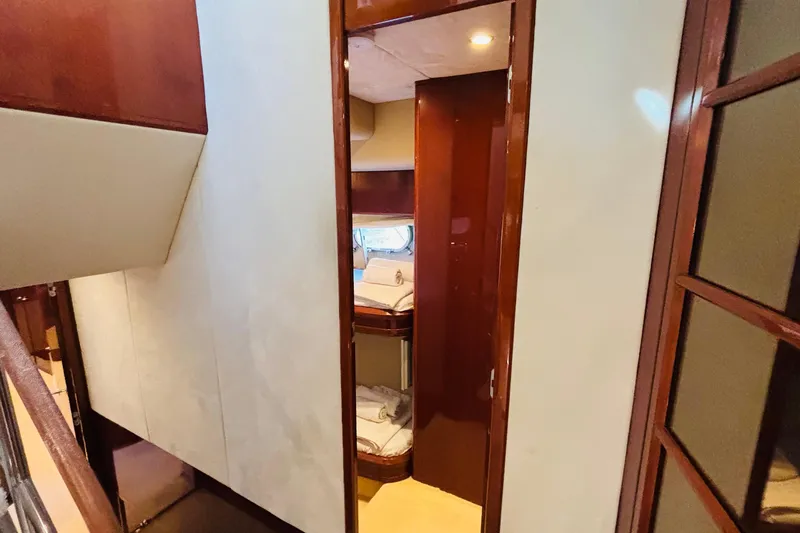  Yacht Photos Pics Interior of 2007 Princess 21M yacht, featuring a cozy cabin with wooden finishes.