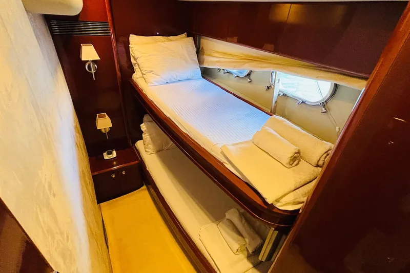  Yacht Photos Pics Luxurious cabin with bunk beds in 2007 Princess 21M yacht.