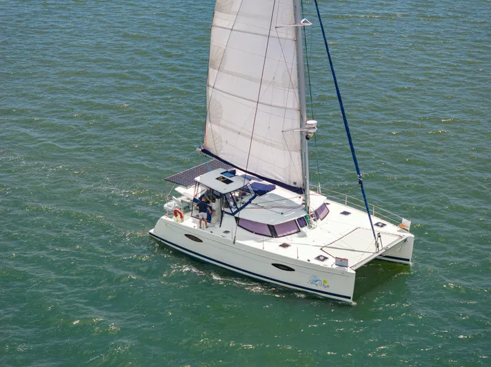 Starry Night Yacht Photos Pics 2014 Fountaine Pajot Helia 44 catamaran sailing on open water.