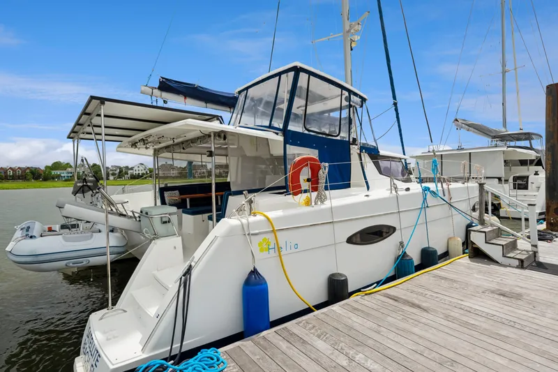 Starry Night Yacht Photos Pics 2014 Fountaine Pajot Helia 44 catamaran docked, featuring spacious deck and modern design.