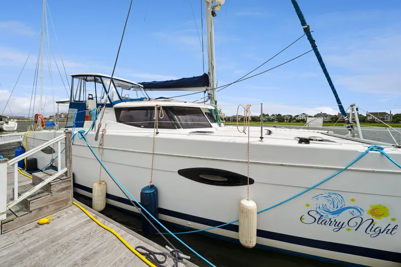 Starry Night Yacht Photos Pics 2014 Fountaine Pajot Helia 44 catamaran "Starry Night" docked at marina.