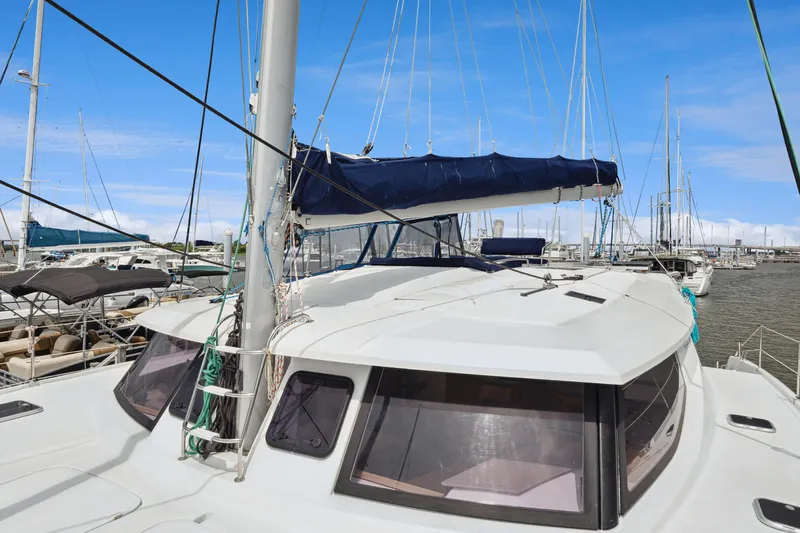 Starry Night Yacht Photos Pics 2014 Fountaine Pajot Helia 44 catamaran docked at marina under clear blue sky.