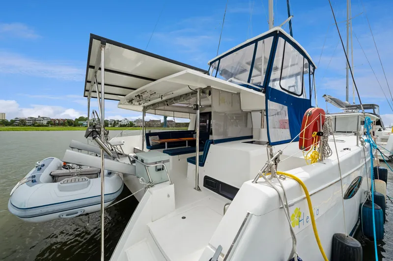 Starry Night Yacht Photos Pics 2014 Fountaine Pajot Helia 44 catamaran docked with inflatable dinghy attached.