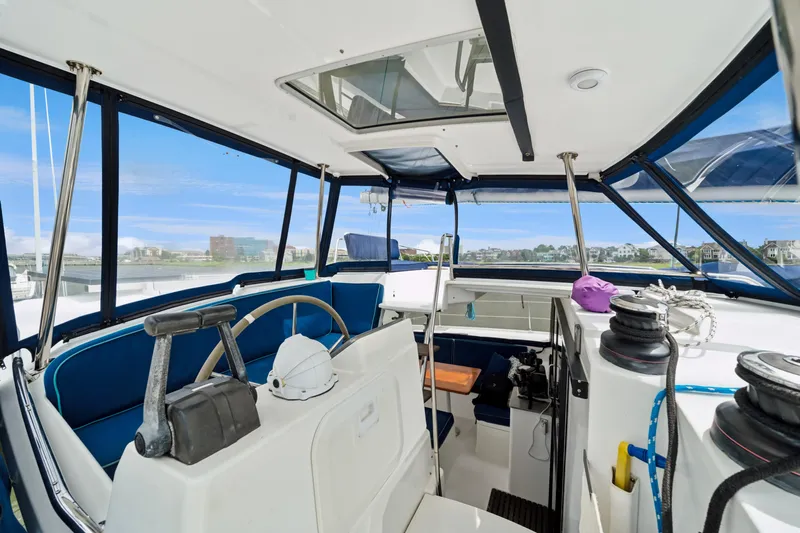 Starry Night Yacht Photos Pics 2014 Fountaine Pajot Helia 44 yacht cockpit with steering wheel and seating area.