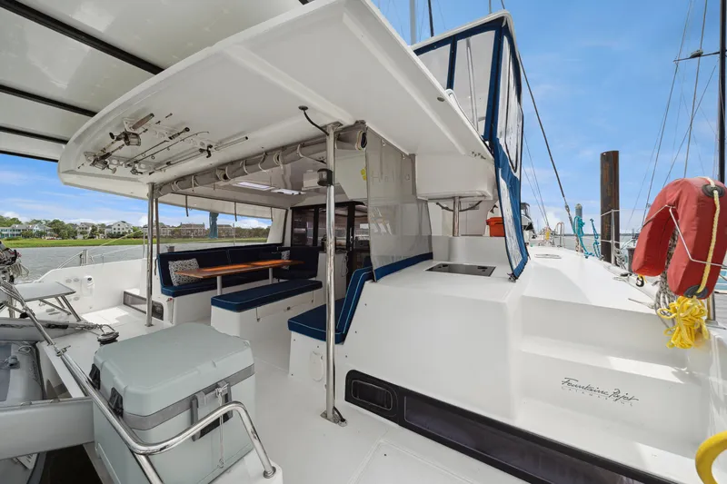 Starry Night Yacht Photos Pics 2014 Fountaine Pajot Helia 44 catamaran with spacious deck and seating area.