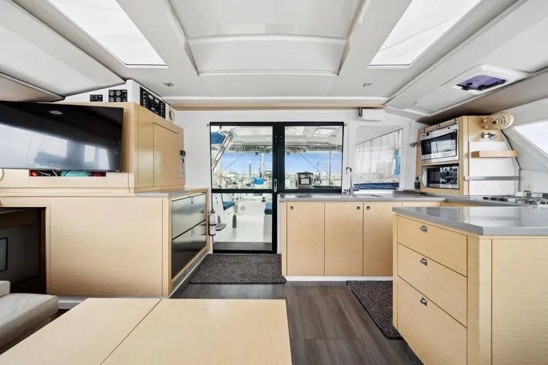 Starry Night Yacht Photos Pics Interior of 2014 Fountaine Pajot Helia 44 catamaran, featuring modern kitchen and spacious layout.