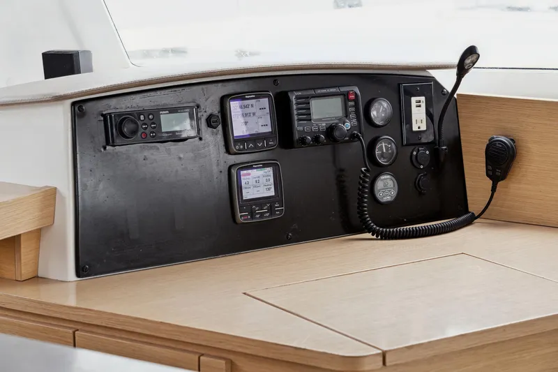 Starry Night Yacht Photos Pics Control panel of 2014 Fountaine Pajot Helia 44 catamaran with navigation instruments.