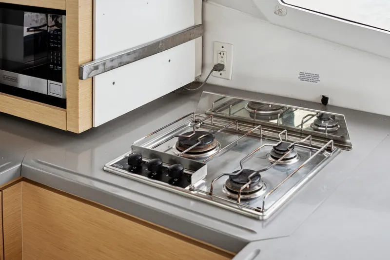 Starry Night Yacht Photos Pics Modern kitchen in 2014 Fountaine Pajot Helia 44 yacht with stove and microwave.