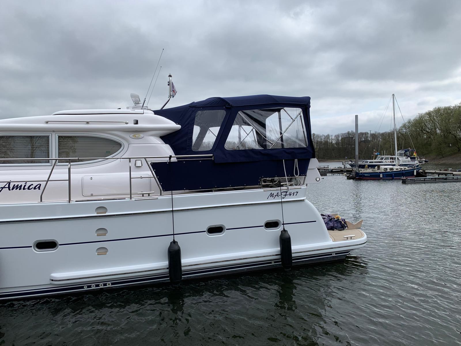 2018 Elling E4 Ultimate yacht docked in a marina under cloudy skies.