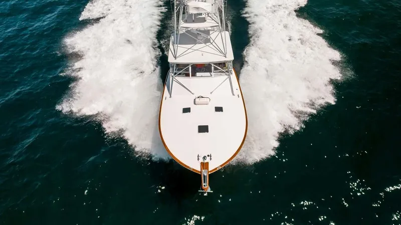  Yacht Photos Pics 1993 Buddy Davis Express Custom Carolina yacht cruising on open water.