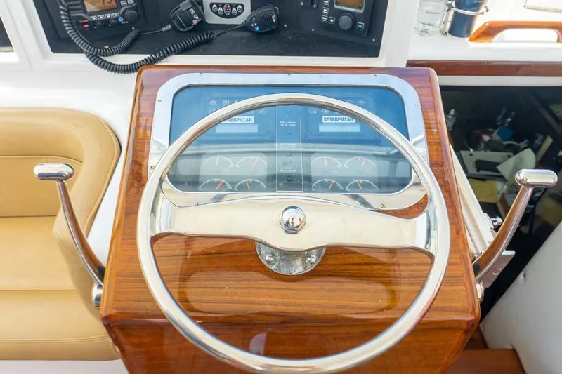  Yacht Photos Pics 1993 Buddy Davis Express Custom Carolina boat helm with wooden steering wheel and control panel.