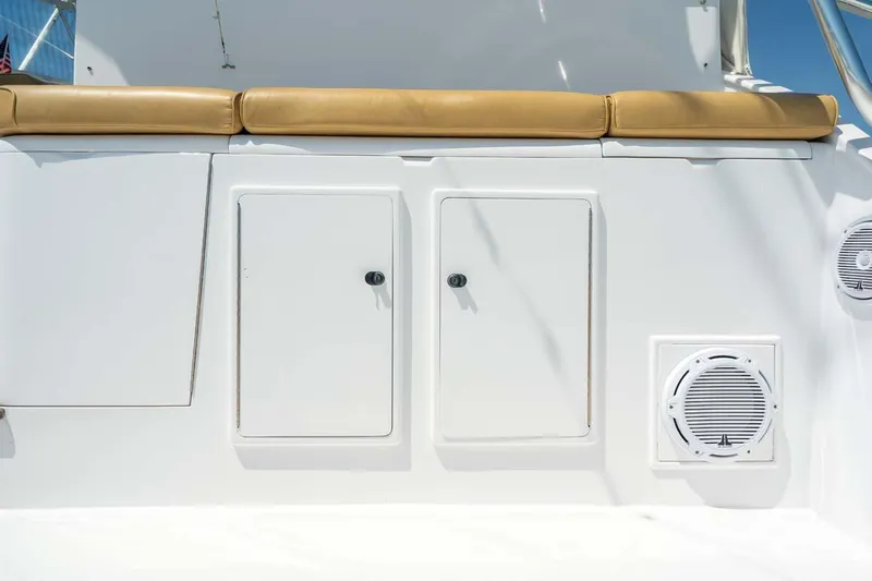  Yacht Photos Pics 1993 Buddy Davis Express Custom Carolina boat with storage compartments and cushioned seating.