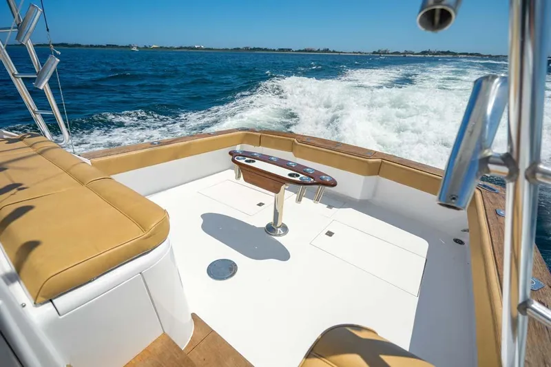  Yacht Photos Pics 1993 Buddy Davis Express Custom Carolina boat cruising on open water.