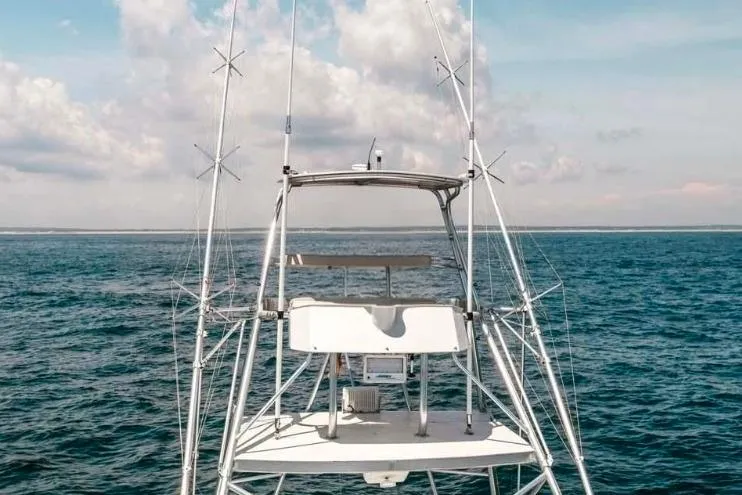  Yacht Photos Pics 1993 Buddy Davis Express Custom Carolina boat on open sea under blue sky.