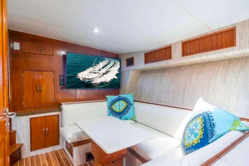  Yacht Photos Pics Luxurious interior of 1993 Buddy Davis Express Custom Carolina yacht with cozy seating and TV.