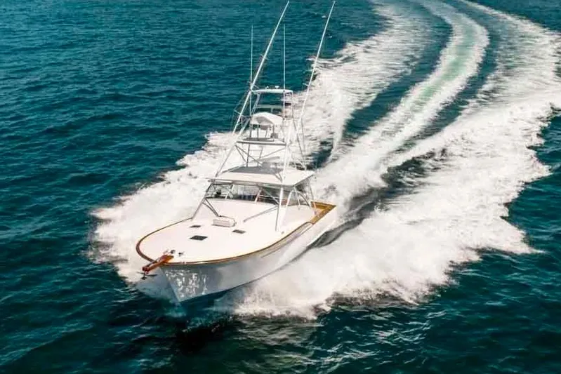  Yacht Photos Pics 1993 Buddy Davis Express Custom Carolina yacht cruising on open water.